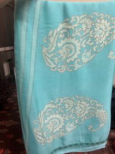 Elegant Teal Saree with Intricate Design