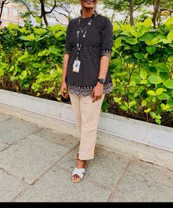 A Black with Beige polka dots top