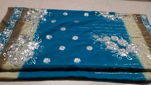 Stunning Teal Blue Saree with Silver Embellishment