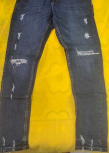Distressed Blue Denim Jeans