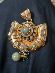 Designer Gold Tone Pendant with Green Stones