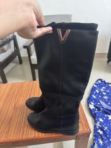 Black Knee-High Boots with Gold Accent