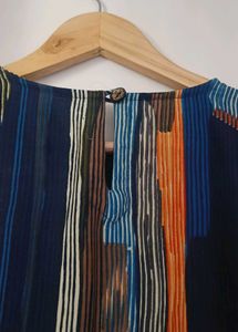 Vibrant Striped Blouse with Tassel Trim