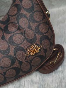 Coach Moon coffee brown with charm 🤎