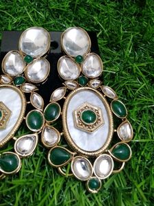 Elegant Oval Earrings with Green Stones