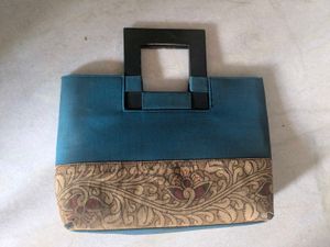 Unique Teal Handbag with Ornate Border