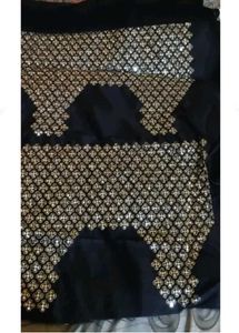 Elegant Black Saree with Golden Embellishments