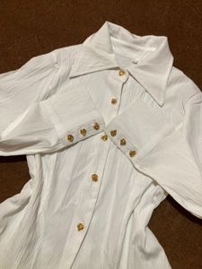 white shirt with gold button details