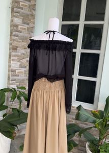 Off-Shoulder Ruffle Black Top with camel skir