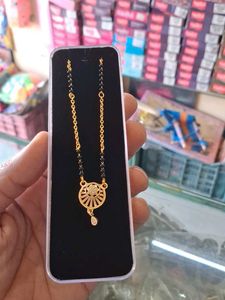Elegant Gold Chain with Black Beads Pendant