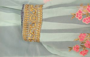 light blue colour fully stitched skirt with golden border in bottom and and work in flair .