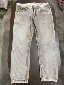 TRUE RELIGION WITH SMALL INK DOT AT BACK