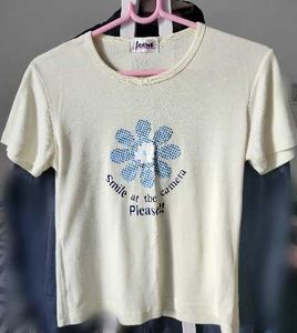 Cream T-Shirt with Blue Flower Graphic