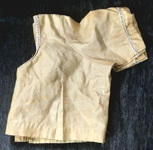 Golden tissue blouse with extra border work