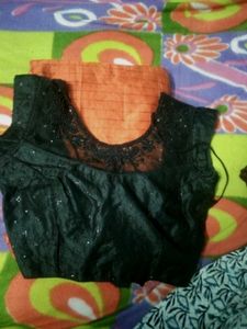 Elegant orange saree and black blouse