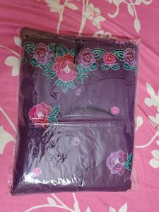 Elegant Purple Saree with Floral Embroidery