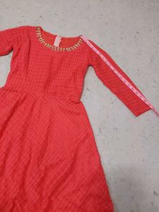 Elegant Coral Lace Gown with Embellished Neckline