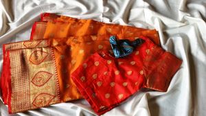 Elegant Orange Silk Saree with Golden Zari