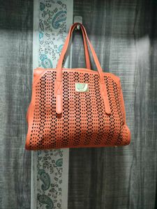 Chic Orange Laser-Cut Handbag