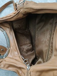 Chic Tan Leather Shoulder Bag with Flower Detail