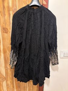 Chic Black Dress with Embellished Sleeves