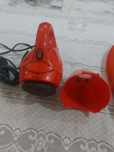 Red hand-held corded electric Vacuum Cleaner