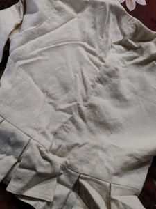 Cream Peplum Blouse with Black Buttons