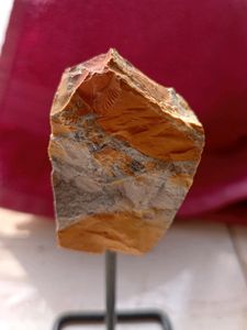 ROUGH CRYSTAL ROCK IN A STAND