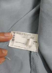 Styli Women Pleated Hem Button Detail Blazer