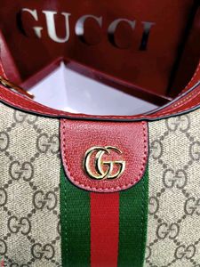 GUCCI* *GG MARMONT HALF-MOON-SHAPED MINI BAG*