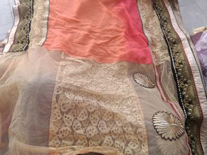 Exquisite Peach and Gold Net Saree