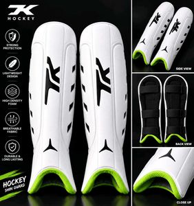 tk  hockey  shin guard and gold boll- size s (ball