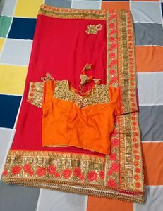 Beautiful Embroidered Red Saree with Orange Blouse