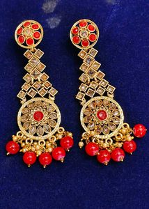 Gold Tone Dangle Earrings with Red Stones