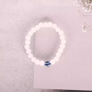White Bead Bracelet with Blue Evil Eye Charm