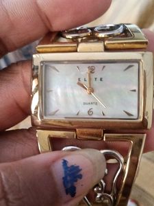 Elite women.s gold & silver bangle watch