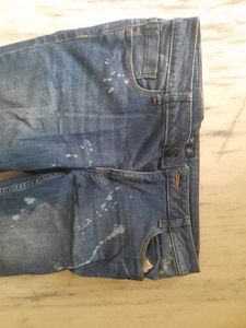 Distressed Blue Jeans with Paint Splatter