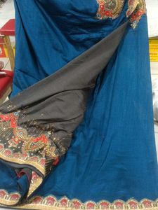 Elegant Teal Saree with Embellished Border