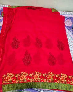 Rani Pink Embroidered Saree with stitched blouse
