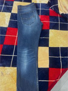 Distressed Blue Denim Jeans
