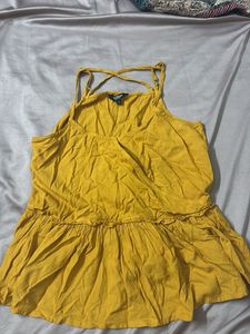 cute mustard sleeveless peplum top