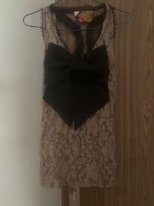 Chic Lace Top with Bold Bow Accent