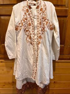 Elegant Cream Kurta with Embroidered Hem