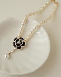 Elegant Pearl Necklace with Flower Pendant