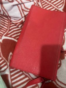 Red Sling Bag With CHANEL Logo