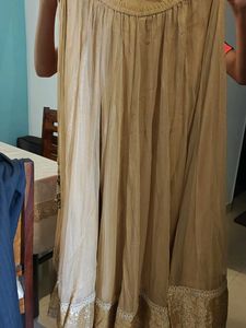 Elegant Beige Skirt with Embellished Hem