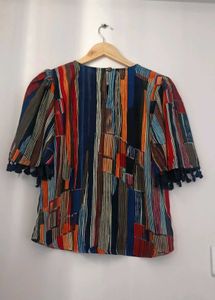 Vibrant Striped Blouse with Tassel Trim