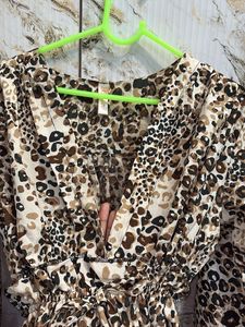 Chic Leopard Print Peplum Blouse – V-Neck Long Sle