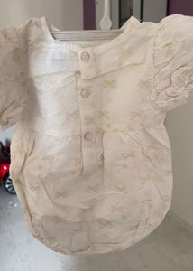 cream infant romper from anko features embroidered