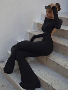 Newme Black Open Back Flare Jumpsuit